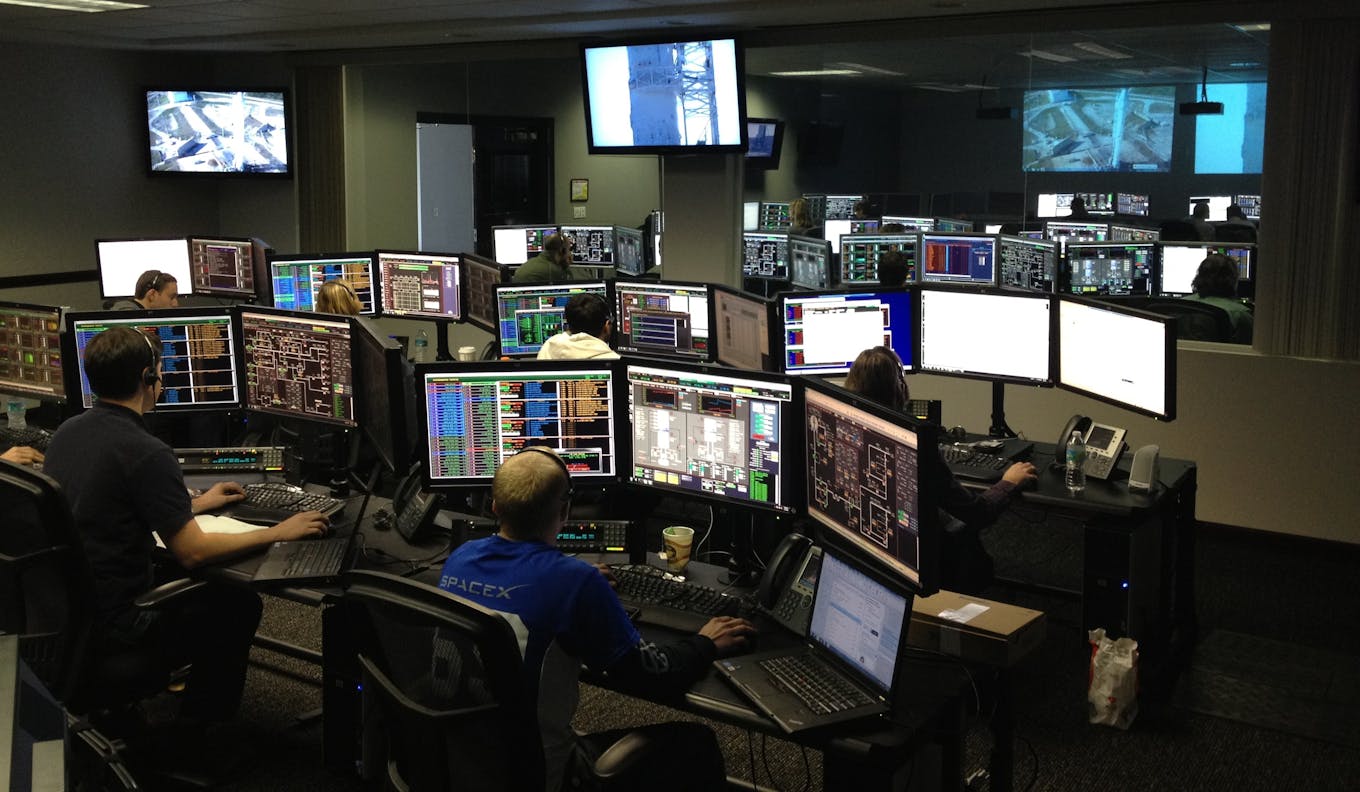 Operations control room with multi-screen monitoring for real-time schedule tracking